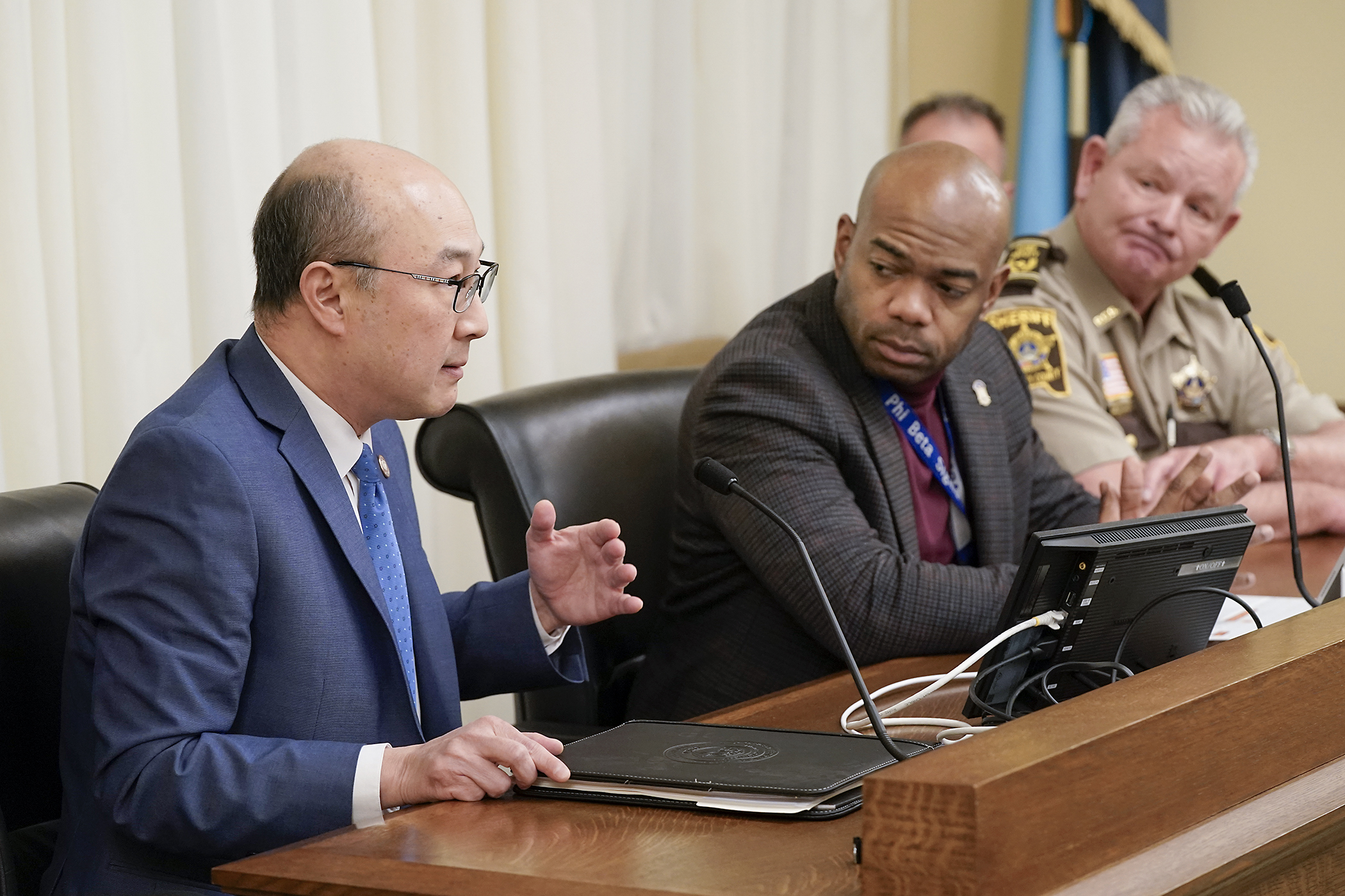 Ramsey County Attorney John Choi testifies before the House public safety committee Tuesday for HF2742 that would provide money for law enforcement agencies to improve the rate of solving nonfatal shootings. Rep. Cedrick Frazier, center, is the sponsor. (Photo by Michele Jokinen)